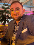 HÜSNÜ ÜNLÜCÖMERT